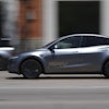 A driverless Tesla robotaxi, a ride-booking service, moves through traffic, Sunday, June 22, 2025, in Austin, Texas.