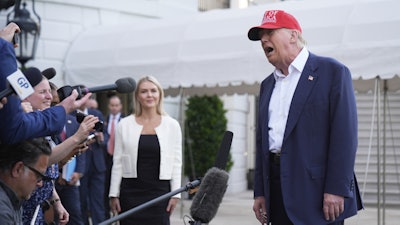 President Donald Trump speaks to the media before walking across the South Lawn of the White House to board Marine One en route to Joint Base Andrews, Md., and on to Florida, Tuesday, July 1, 2025, in Washington.