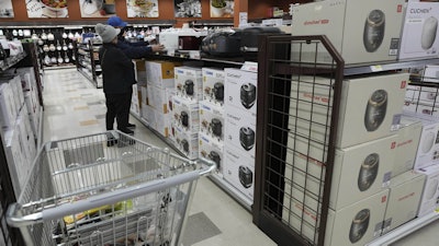 Shoppers shop electric rice cookers imported from Japan and Korea at the H Mart in Niles, Ill., April 3, 2025.