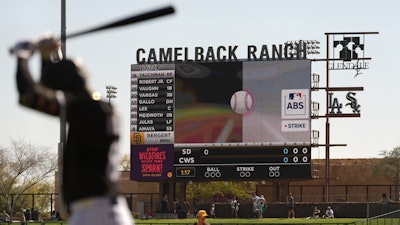 The Automated Ball-Strike System plays on the scoreboard after a pitch call was challenged during the first inning of a spring training baseball game between the Chicago White Sox and the San Diego Padres, Feb. 26, 2025, in Phoenix.