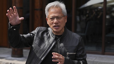 CEO of Nvidia Jensen Huang speaks during a press conference at the Mandarin Oriental Qianmen after attending the third China International Supply Chain Expo, in Beijing, Wednesday, July 16, 2025.
