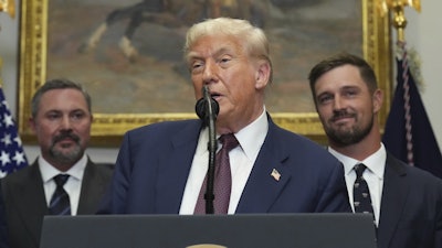 President Trump speaks alongside Cody Campbell, left, and professional golfer Bryson DeChambeau in the Roosevelt Room of the White House, July 31, 2025.
