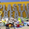 Plastic items are seen on Place des Nations in front of the European headquarters of the United Nations in Geneva, Switzerland, Monday, Aug. 4, 2025 before the second segment of the fifth session of the Intergovernmental Negotiating Committee on Plastic Pollution (INC-5.2).