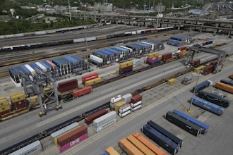 Shipping containers are loaded onto trucks at CSX Queensgate Rail Yard, May 7, 2025, Cincinnati.