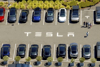 Tesla vehicles line a parking area at the company's Fremont, Calif., factory on Tuesday, Aug. 5, 2025.
