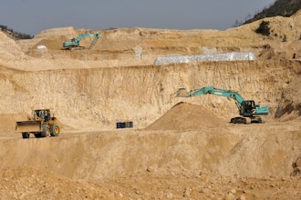 Workers use machinery to dig at a rare earth mine in Ganxian county in central China's Jiangxi province on Dec. 30, 2010.
