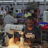 A worker stitches a footwear in a manufacturing unit in Agra, India, Monday, Aug. 25, 2025.