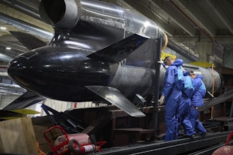 Workers inspect a Flamingo cruise missile at Fire Point's secret factory in Ukraine on Monday, Aug. 18, 2025.
