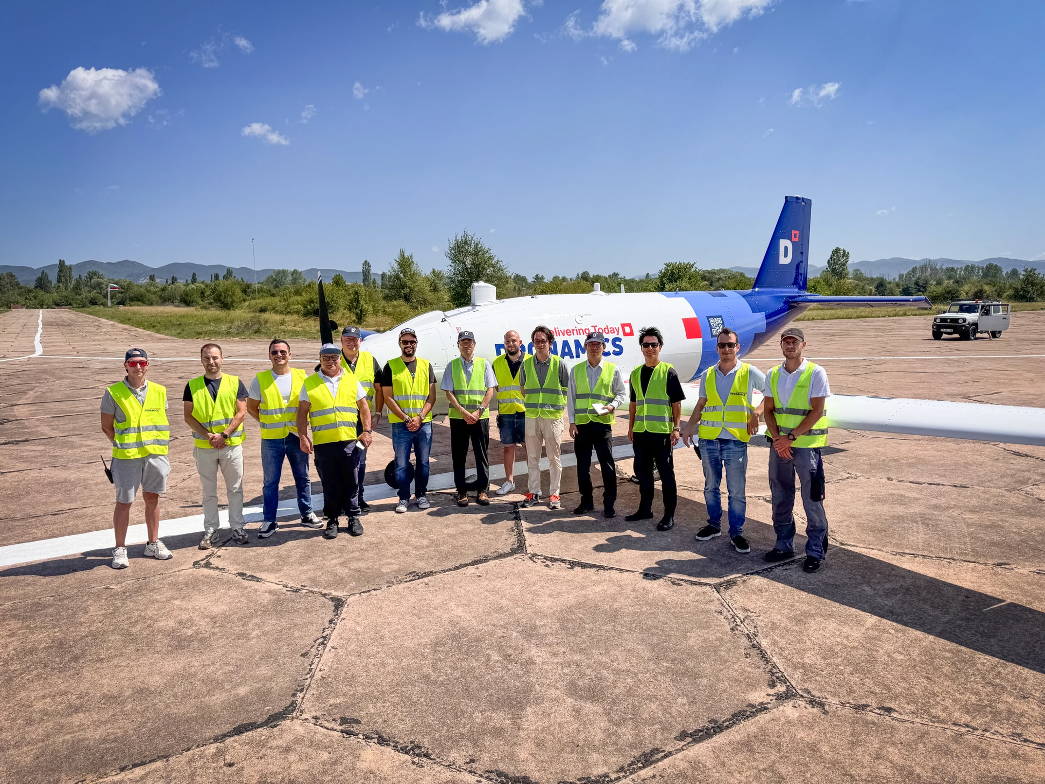 Kawasaki Motors and Dronamics teams in front of the Black Swan UAV in Sofia, Bulgaria