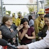 Student Marianna Torres, 11, center, cries as she evacuates Park Avenue Elementary School after jet fuel fell on the school in Cudahy, Calif., Jan. 14, 2020.