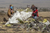Workers recover debris at the scene of an Ethiopian Airlines Boeing Max plane crash on March 11, 2019, outside of Addis Ababa, Ethiopia.
