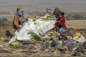 Workers recover debris at the scene of an Ethiopian Airlines Boeing Max plane crash on March 11, 2019, outside of Addis Ababa, Ethiopia.