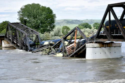 Train cars are immersed in the Yellowstone River after a bridge collapse near Columbus, Mont., June 24, 2023.