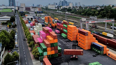 Containers are piled upon a cargo terminal in Frankfurt, Germany, Tuesday, Sept. 9, 2025.