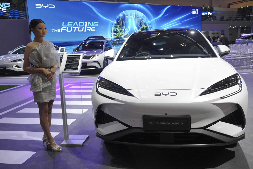 A model stands near a Sealion 7, an electric vehicle from Chinese automaker BYD, during the Gaikindo Indonesia International Auto Show in Tangerang, Indonesia, Wednesday, July 23, 2025.