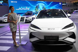 A model stands near a Sealion 7, an electric vehicle from Chinese automaker BYD, during the Gaikindo Indonesia International Auto Show in Tangerang, Indonesia, Wednesday, July 23, 2025.