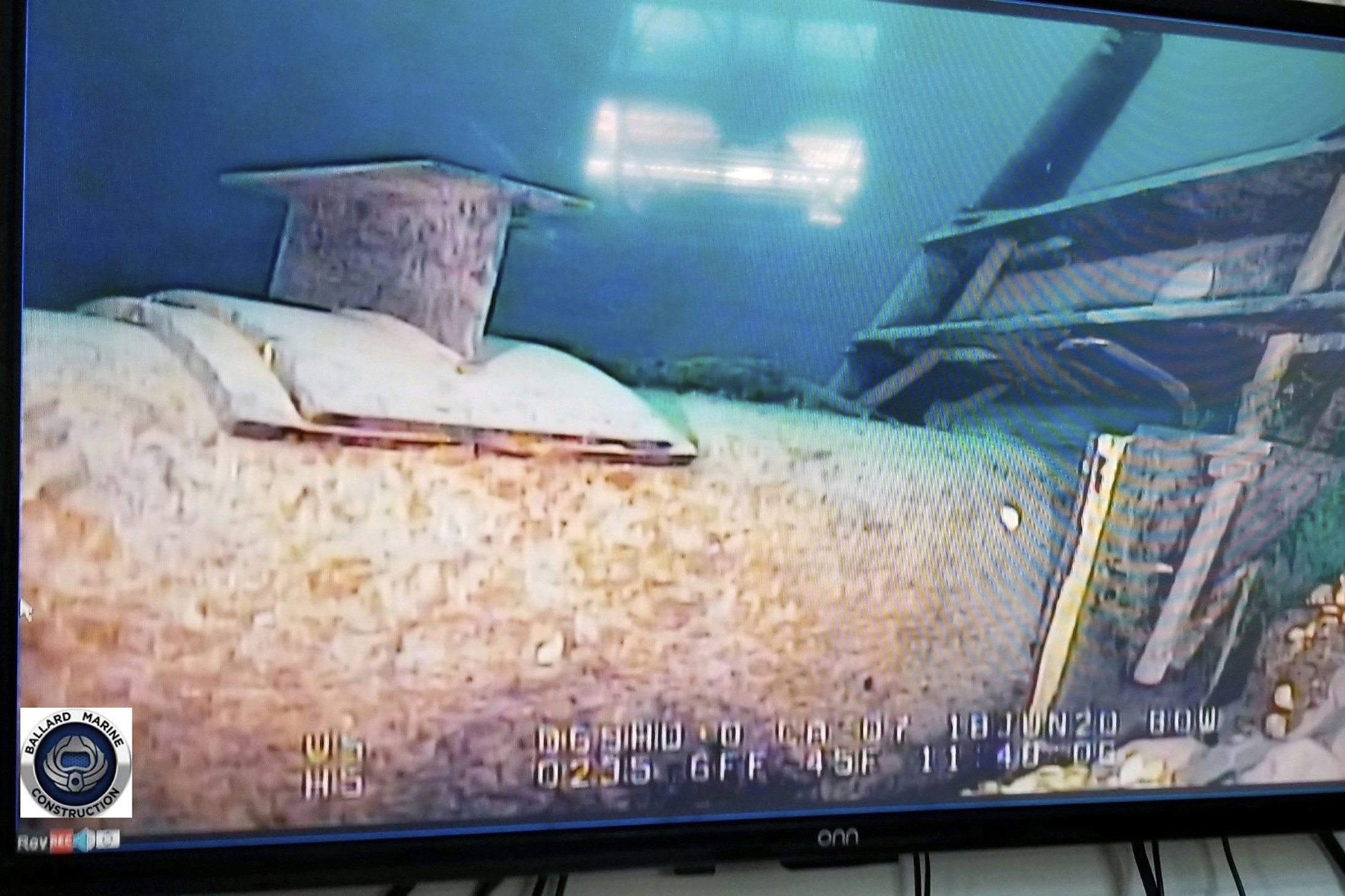 This photo provided by the Michigan Department of Environment, Great Lakes, and Energy in June 2020 shows damage to anchor support EP-17-1 on the east leg of the Enbridge Line 5 pipeline in the Straits of Mackinac in Michigan, displayed on a television screen.