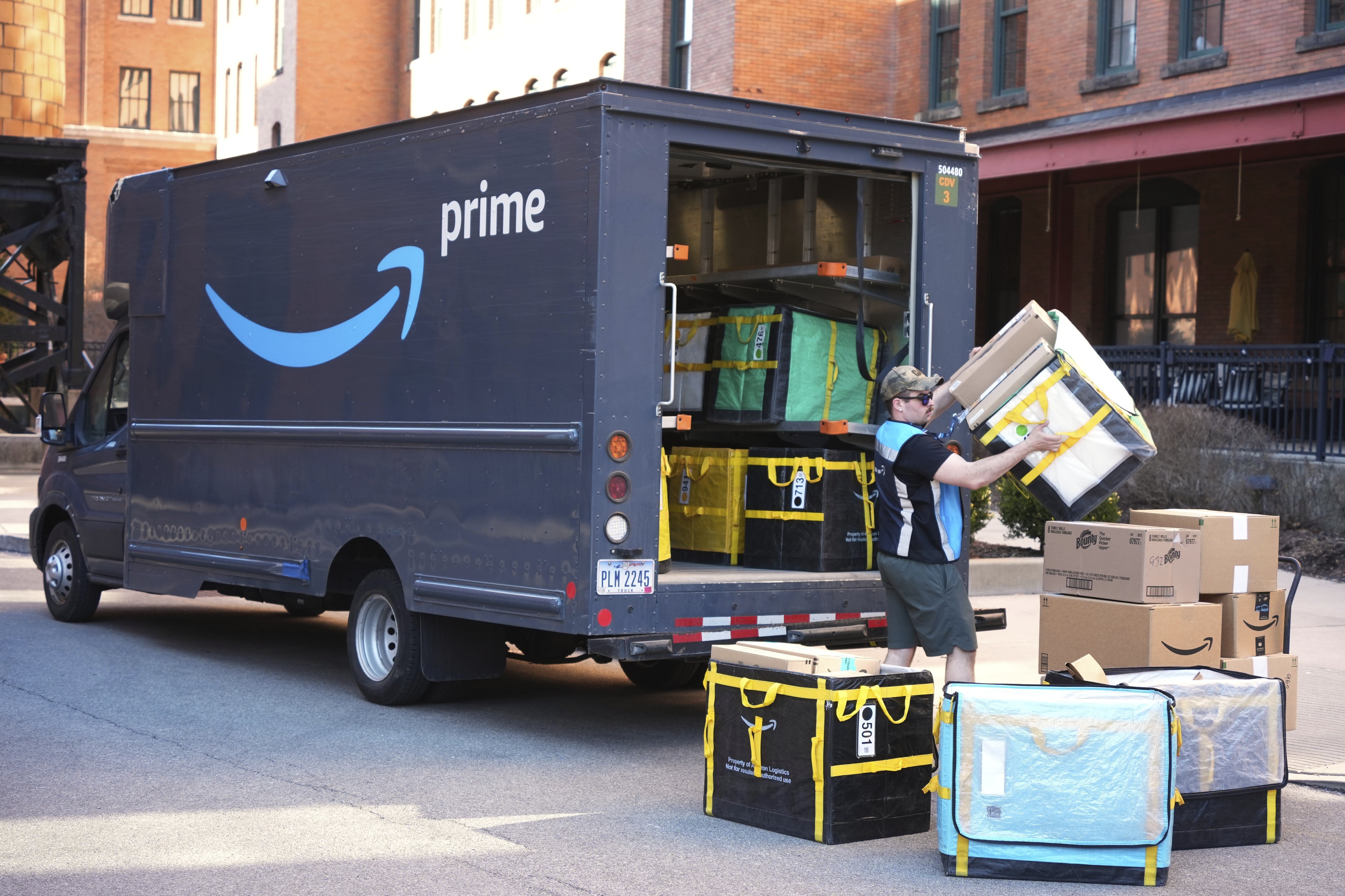 An Amazon driver makes a delivery outside an apartment building in Pittsburgh, March 10, 2025.
