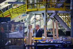 Prime Minister Mark Carney walks through a manufacturing facility ahead of a press conference in Mississauga, Ont., on Friday, Sept. 5, 2025.