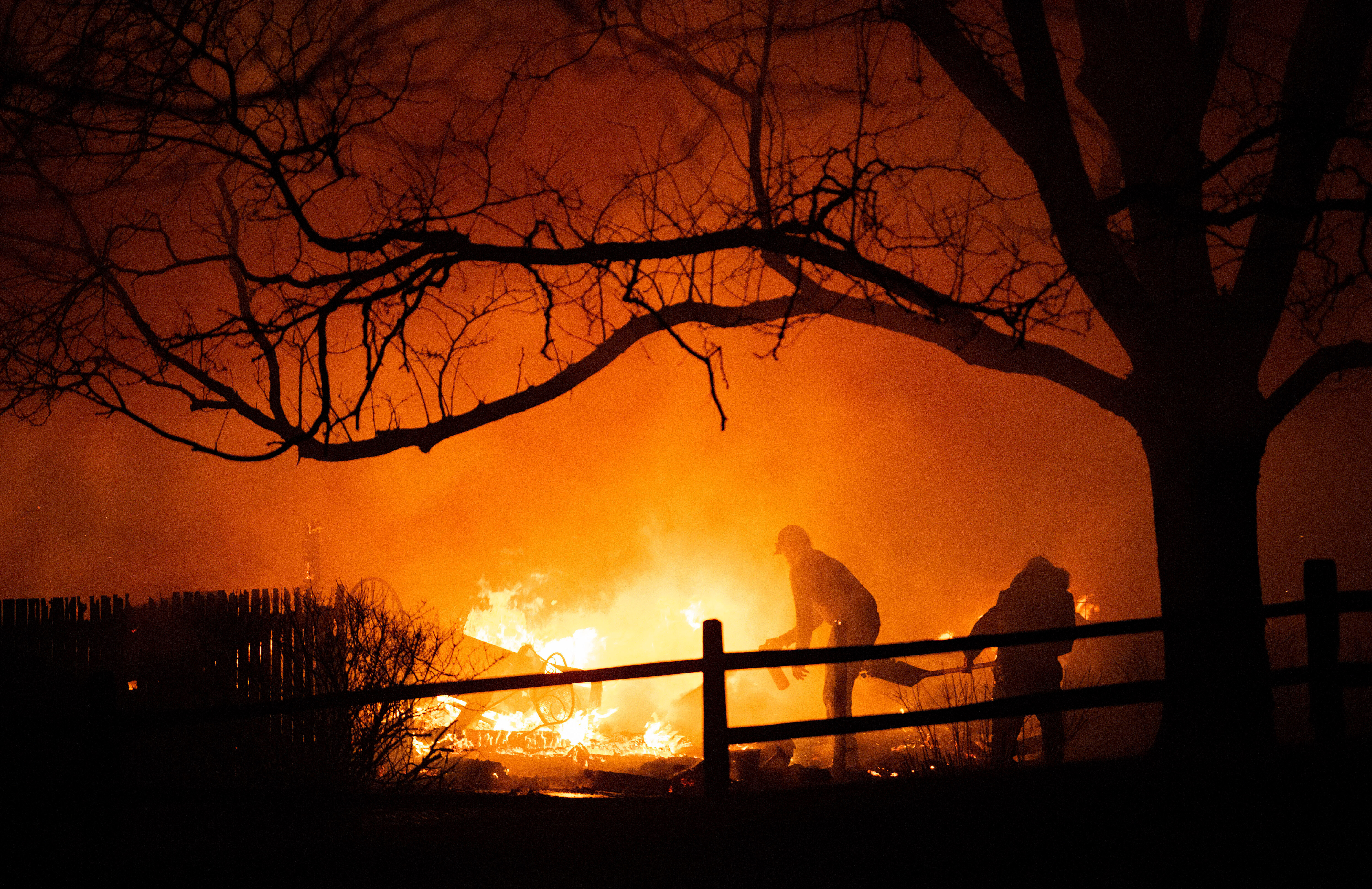Residents fight the Marshall Fire in Louisville, Colo., Dec. 30, 2021.