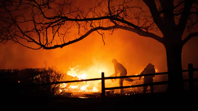 Residents fight the Marshall Fire in Louisville, Colo., Dec. 30, 2021.