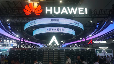 Visitors pass by the Huawei Atlas 900 A3 SuperPoD exhibited at the World Artificial Intelligence Conference in Shanghai, China, July 28, 2025.