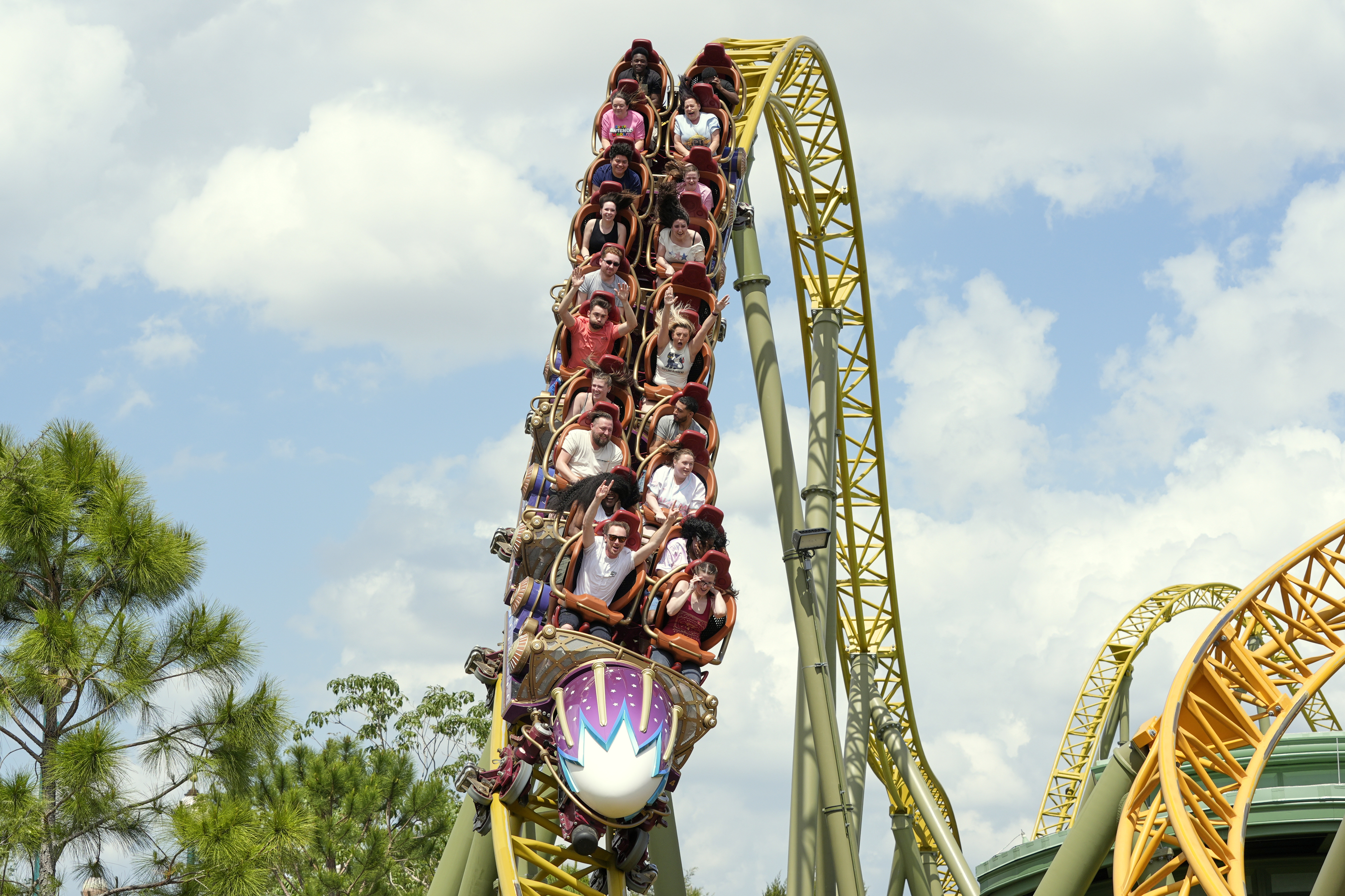 Guests ride on the Stardust Racers roller coaster at Epic Universe Theme Park at Universal Resort Orlando, April 10, 2025, in Orlando, Fla.