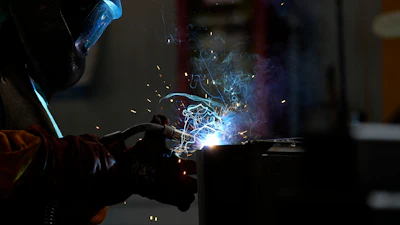 A man works at MAP, a factory operating in design, manufacture and installation of steel structures for civil and industrial use, in Corsico, Italy, May 12, 2022.
