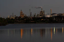 Lights from the Phillips 66 Los Angeles Refinery Wilmington Plant are reflected in the water at dusk, Thursday, Oct. 2, 2025, in Los Angeles.