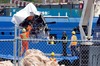 Debris from the Titan submersible, recovered from the ocean floor near the wreck of the Titanic, is unloaded from the ship Horizon Arctic at the Canadian Coast Guard pier in St. John's, Newfoundland, June 28, 2023.