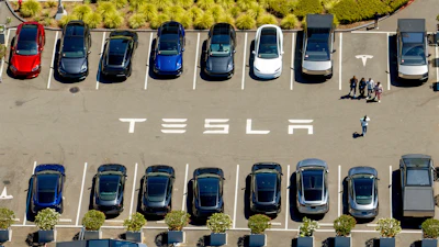 Tesla vehicles line a parking area at the company's Fremont, Calif., factory on Tuesday, Aug. 5, 2025.