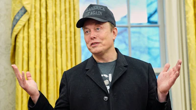 Elon Musk speaks during an event with President Donald Trump in the Oval Office at the White House, Feb. 11, 2025, in Washington.