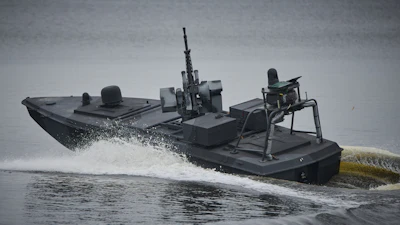 Ukraine's Security Service officers stand by Sea Baby drones, during a demonstration at an undisclosed location in Ukraine Friday, Oct. 17, 2025.