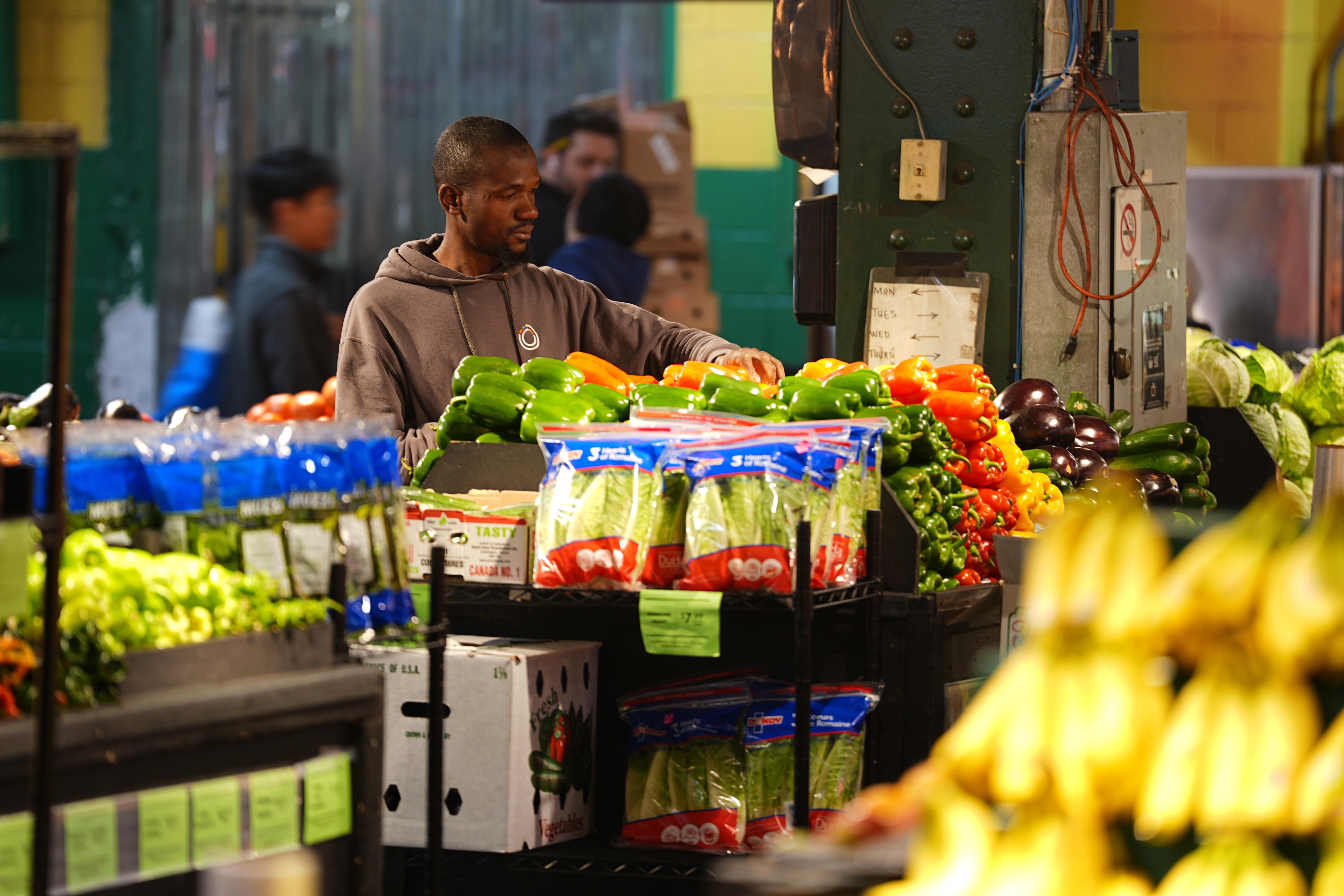 A worker arranges produce at the Reading Terminal Market in Philadelphia, Oct. 29, 2025.
