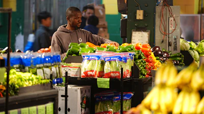 A worker arranges produce at the Reading Terminal Market in Philadelphia, Oct. 29, 2025.