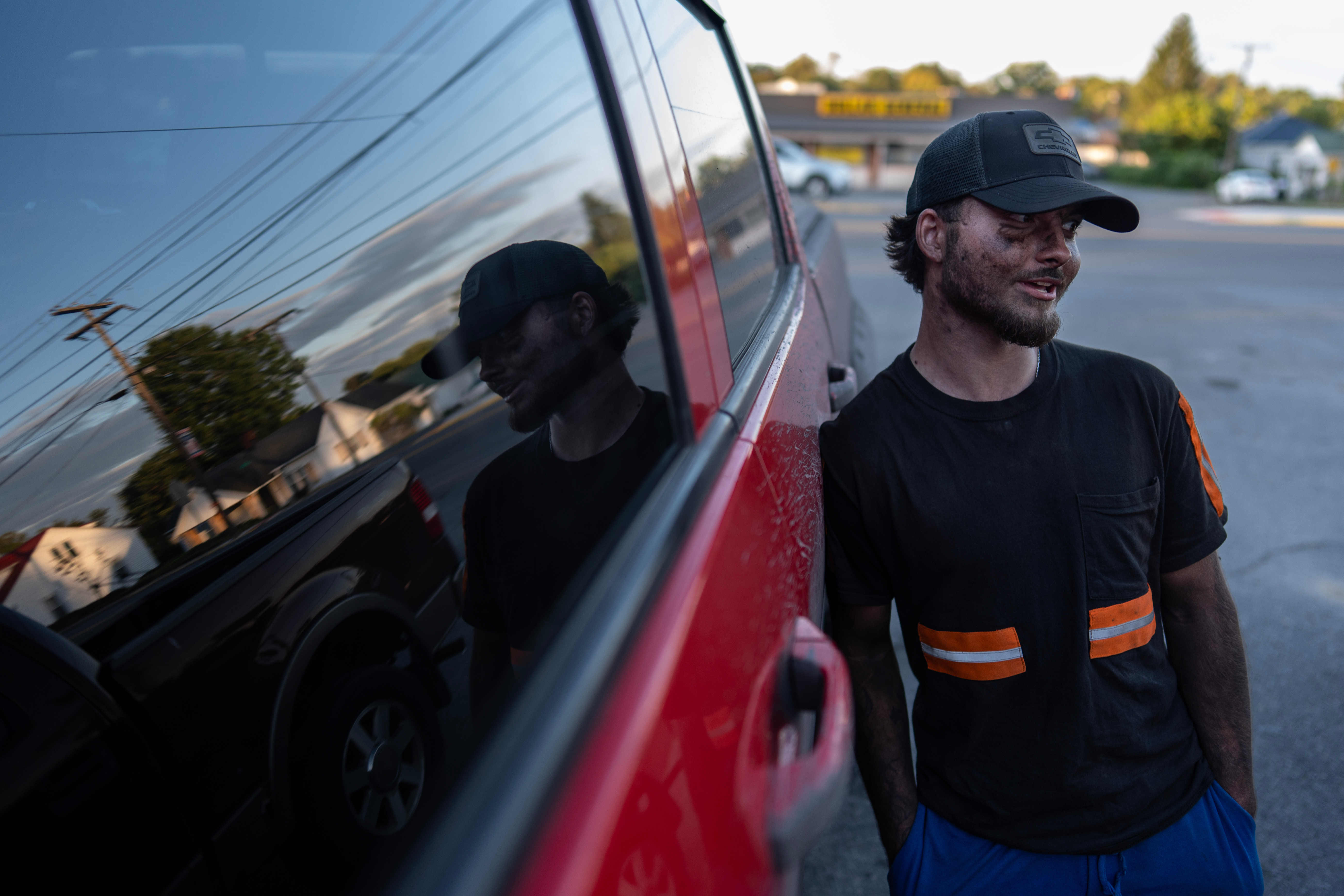 Coal miner Ethan Carper leans against his truck outside a convenience store, Wednesday, Sept. 17, 2025, in Oak Hill, W.Va.