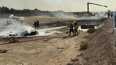 Emergency services attend the scene after an Indian HAL Tejas crashed during a demonstration at the Dubai Air Show, at Al Maktoum International Airport at Dubai World Central, Dubai, United Arab Emirates, Friday Nov. 21, 2025.