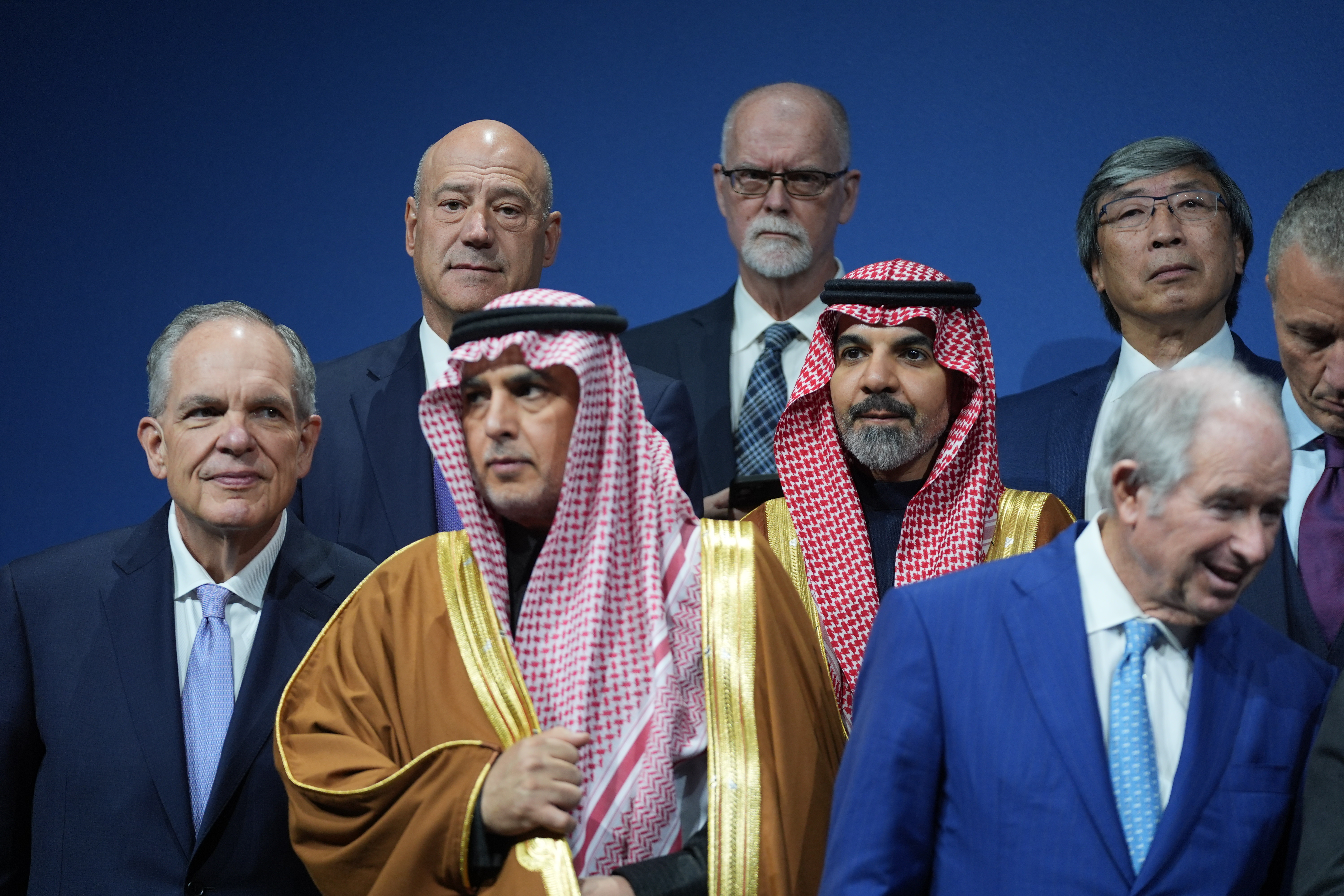 Saudi Investment Forum participants stand together before they are photographed as a group with President Donald Trump and Saudi Arabia's Crown Prince Mohammed bin Salman at the Kennedy Center, Wednesday, Nov. 19, 2025, in Washington.