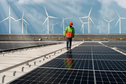 Engineer inspecting solar panels.