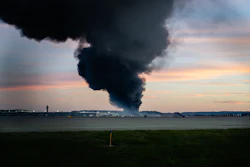 A plume of smoke rises from the site of a UPS cargo plane crash at Louisville Muhammad Ali International Airport on Tuesday, Nov. 4, 2025, in Louisville, Ky.