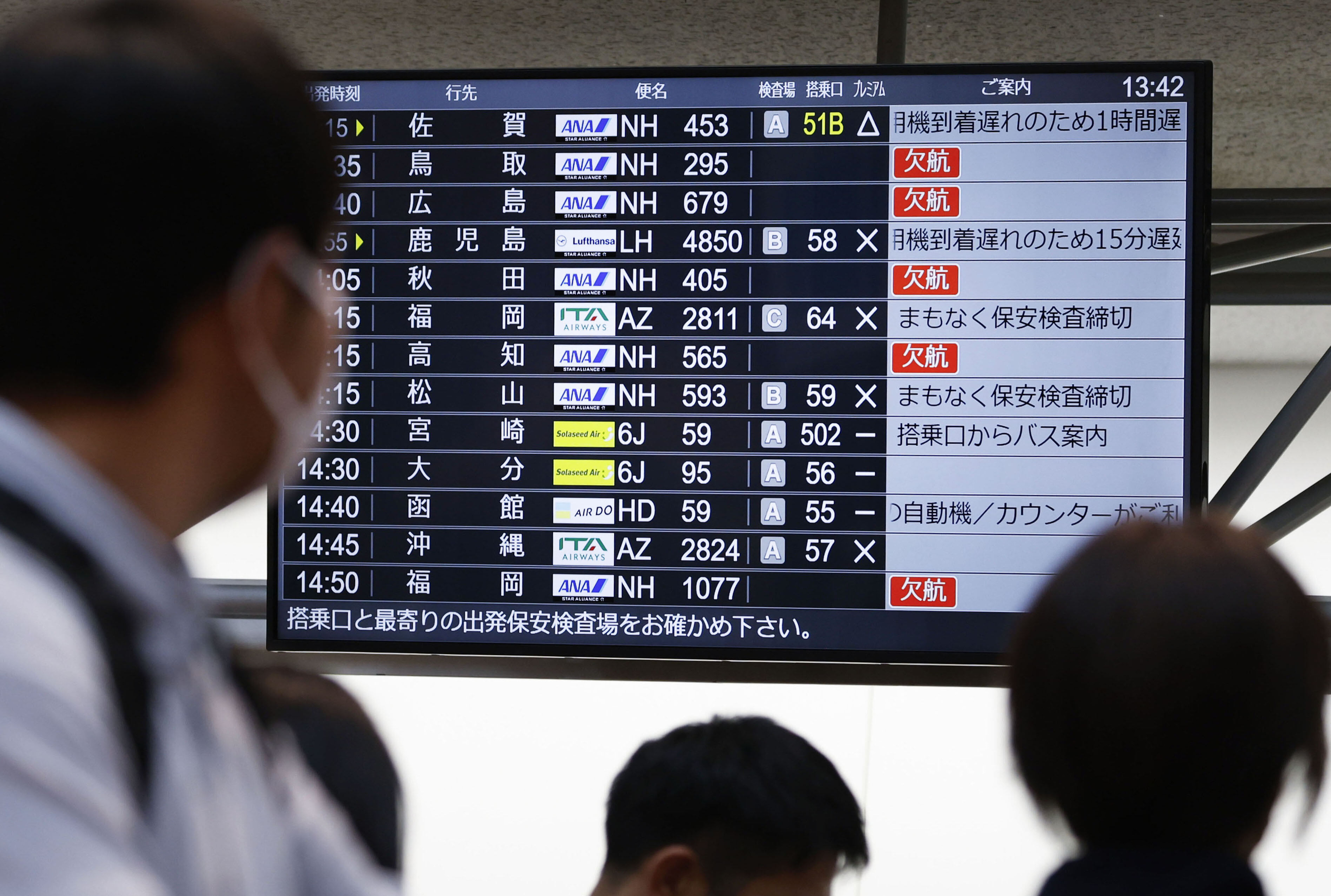 The departures display board shows All Nippon Airways' multipule flights cancellation at Haneda airport in Tokyo Saturday, Nov. 29, 2025.
