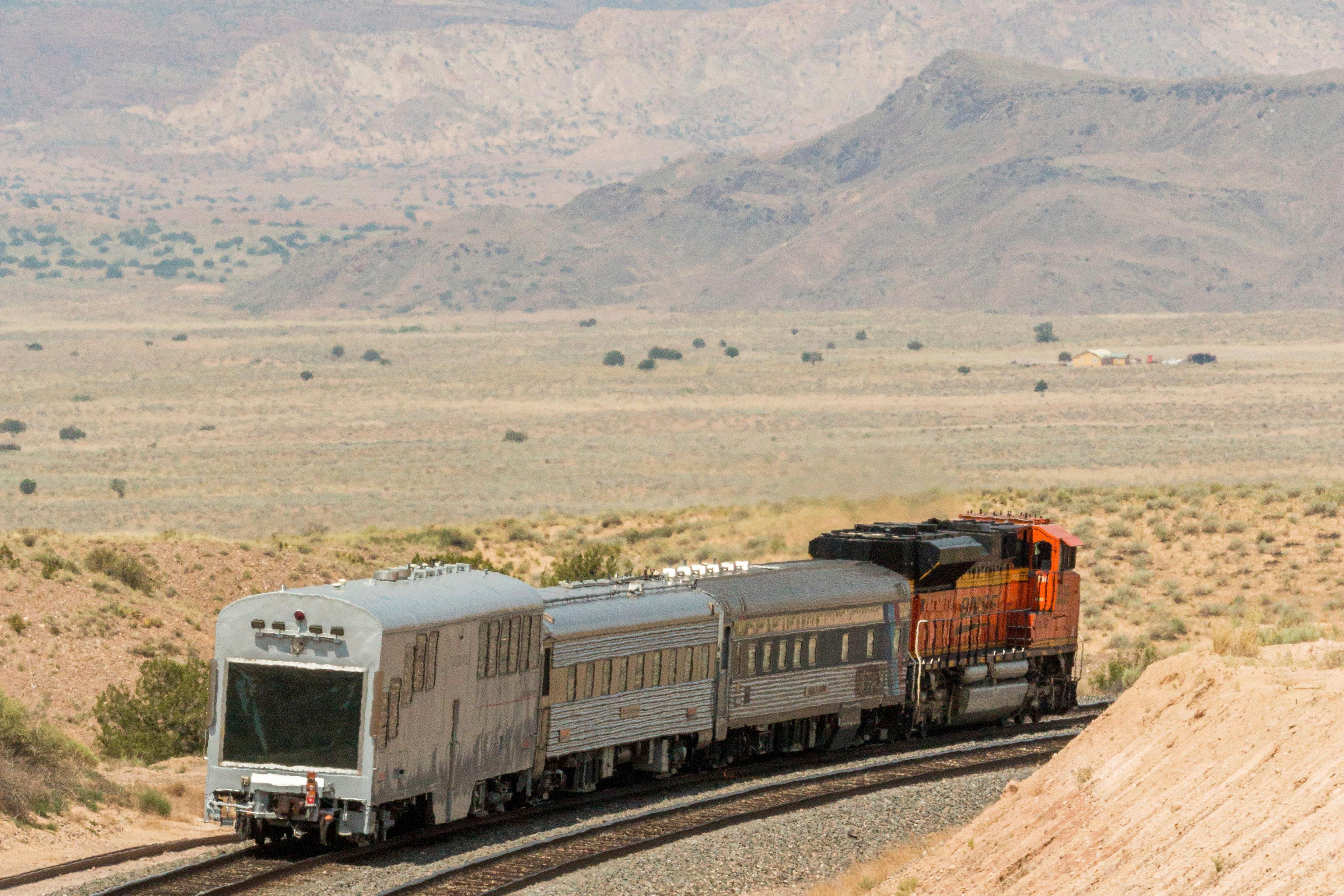 A BNSF locomotive pulls an automated track inspection railcar down the tracks in Valencia County, New Mexico, July 31, 2018.