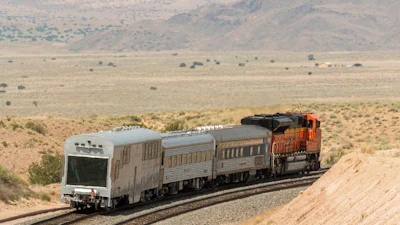 A BNSF locomotive pulls an automated track inspection railcar down the tracks in Valencia County, New Mexico, July 31, 2018.