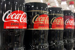 Bottles of Coca-Cola products sit on a shelf at a store in Dania Beach, Fla., Oct. 20, 2020.