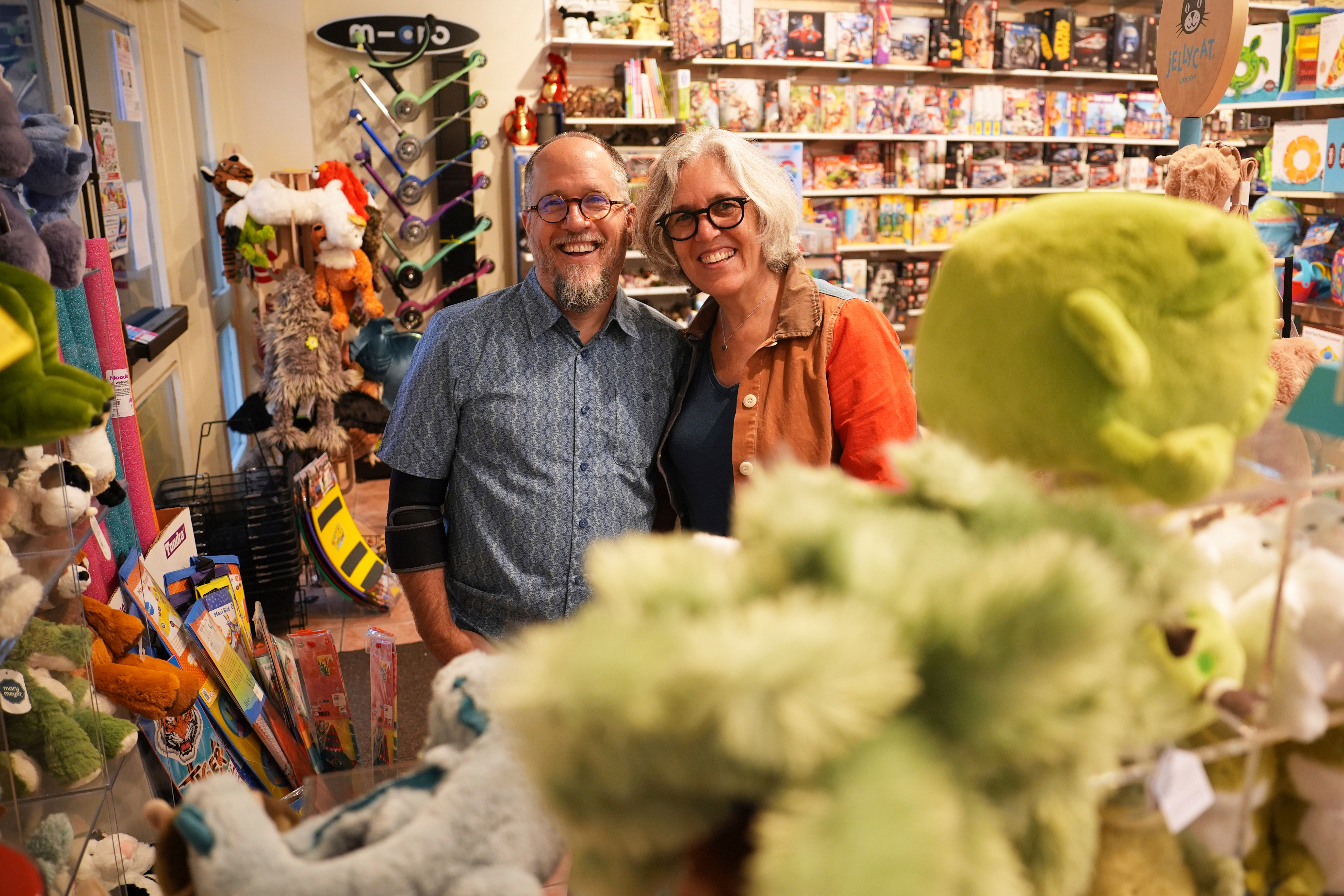Co-owners Dean Smith, left, and Joanne Farrugia pose for a photograph in JaZams, one of their toy stores Friday, June 27, 2025, in Princeton, N.J.