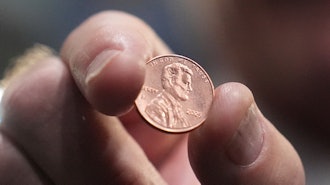 U.S. Treasurer Brandon Beach holds one of the last pennies pressed at the U.S. Mint, in Philadelphia, Nov. 12, 2025.