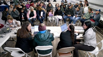Tyson Foods employees at an informational meeting held by the Nebraska Department of Labor in Lexington, Neb., Dec. 3, 2025.