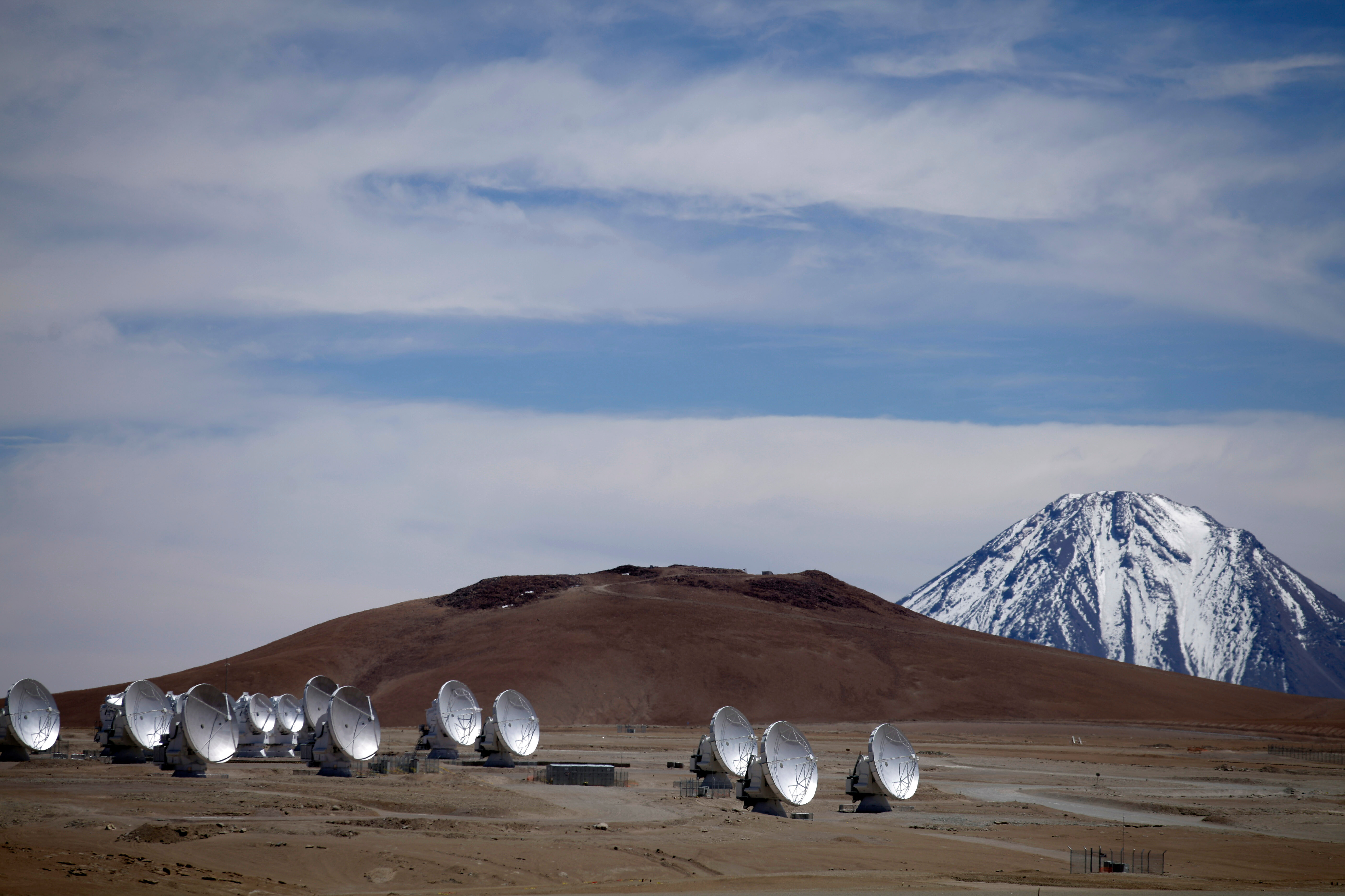 Radio antennas are spread out on the terrain as part of one of the world's largest astronomy projects, the Atacama Large Millimeter/submillimeter Array (ALMA) in Chajnator in the Atacama desert in northern Chile, Sept. 27, 2012.