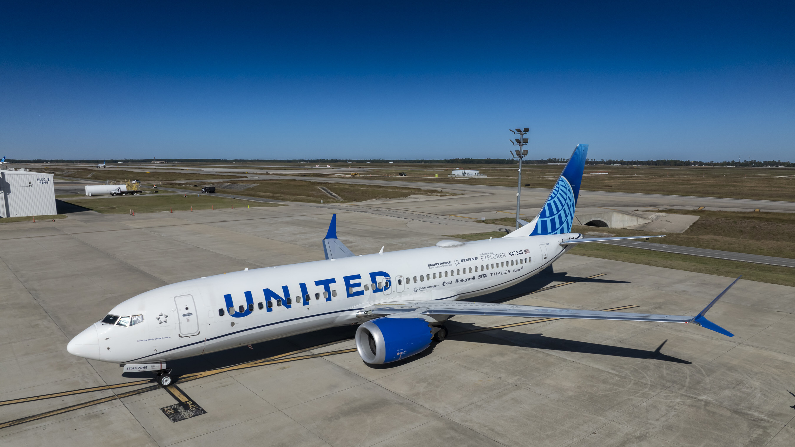 The 2025 Boeing ecoDemonstrator Explorer, a United Airlines 737-8, sits outside a United hangar in Houston before its first flight to test Internet Protocol Suite