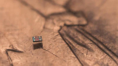 A microrobot on a U.S. penny, showing scale.